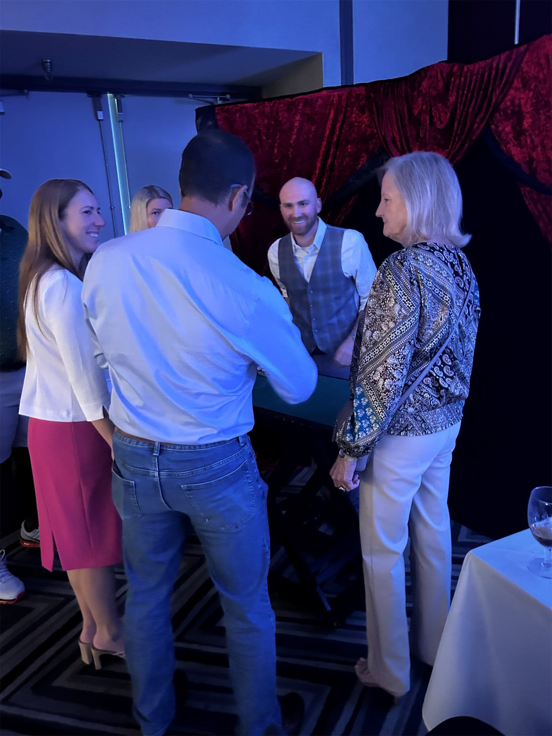 Dylan Looper performing close-up magic at a corporate networking event