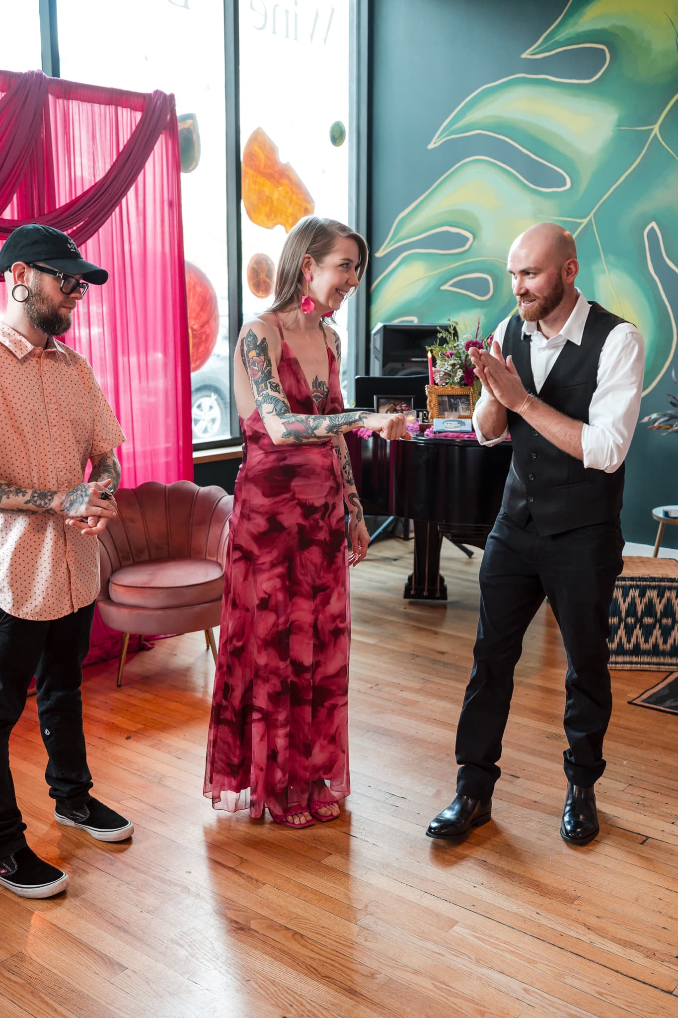 Dylan Looper celebrating with the bride after a magic trick at an Asheville wedding reception